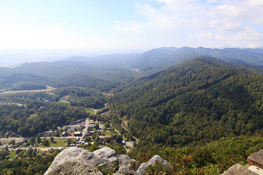 About Our Agency - Aerial View of City in the Valley From the Top of Mountain Range