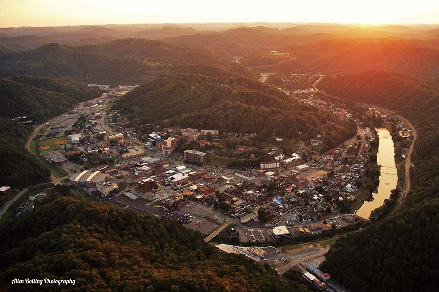 Pikeville, KY - Aerial View of the City of Pikeville Kentucky Surrounded by Hills at Sunset